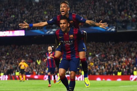 BARCELONA, SPAIN - APRIL 21:  Neymar of Barcelona celebrates with Daniel Alves (front) as he scores their second goal during the UEFA Champions League Quarter Final second leg match between FC Barcelona and Paris Saint-Germain at Camp Nou on April 21, 2015 in Barcelona, Spain.  (Photo by David Ramos/Getty Images)