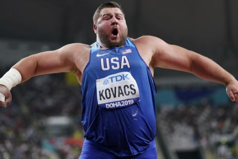 Joe Kovacs, of the United States, celebrates winning the championship record for gold in the men's shot put final at the World Athletics Championships in Doha, Qatar, Saturday, Oct. 5, 2019. (AP Photo/David J. Phillip)