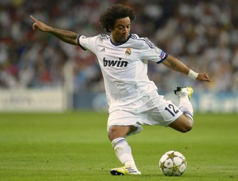 Real Madrid's Marcelo shoots towards the goal during his Champions League Group D soccer match against Manchester City at the Santiago Bernabeu stadium in Madrid, September 18, 2012. REUTERS/Felix Ordonez (SPAIN  - Tags: SPORT SOCCER)  