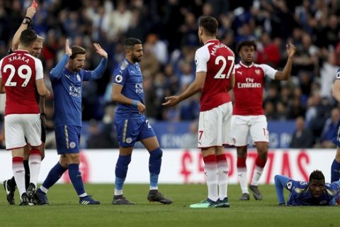 Arsenal's Konstantinos Mavropanos, no. 27, is sent off by match referee Graham Scott during the English Premier League soccer match against Leicester City at the King Power Stadium, Leicester, England, Wednesday May 9, 2018. (David Davies/PA via AP)