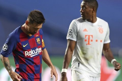 Barcelona's Lionel Messi, left, leaves he pitch at half time during the Champions League quarterfinal soccer match between Barcelona and Bayern Munich in Lisbon, Portugal, Friday, Aug. 14, 2020. (Rafael Marchante/Pool via AP)