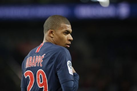PSG's Kylian Mbappe looks at his teammates during the League One soccer match between Paris Saint-Germain and Stade Rennais at the Parc des Princes stadium in Paris, Saturday May 12, 2018. (AP Photo/Christophe Ena)