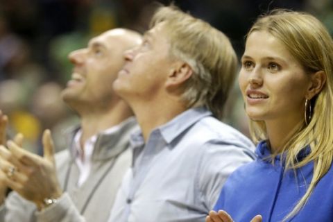 Mallory Edens, daughter of Milwaukee Bucks co-owner Wes Edens, claps during the second half of an NBA basketball game between the Milwaukee Bucks and the Memphis Grizzlies Monday, Nov. 13, 2017, in Milwaukee. (AP Photo/Aaron Gash)