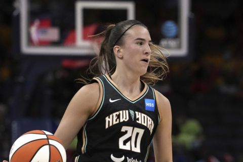 New York Liberty guard Sabrina Ionescu (20) plays against the Indiana Fever in the first half of a WNBA basketball game in Indianapolis, Wednesday, July 12, 2023. (AP Photo/Michael Conroy)