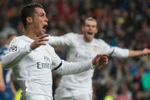 "Real Madrid's Portuguese forward Cristiano Ronaldo celebrates after scoring during the Champions League quarter-final second leg football match Real Madrid vs Wolfsburg at the Santiago Bernabeu stadium in Madrid on April 12, 2016. / AFP / CURTO DE LA TORRE        (Photo credit should read CURTO DE LA TORRE/AFP/Getty Images)"