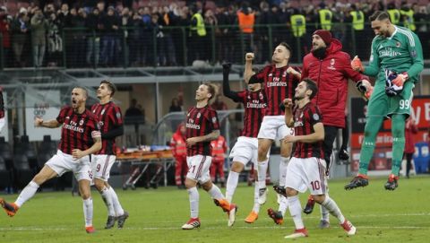 AC Milan players celebrate at the end of an Italian Serie A soccer match between AC Milan and Sampdoria, at the San Siro stadium in Milan, Italy, Sunday, Feb. 18, 2018. Milan won 1 - 0. (AP Photo/Antonio Calanni)