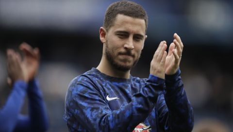 Chelsea's Eden Hazard waves to fans at the end of the English Premier League soccer match between Chelsea and Watford at Stamford Bridge stadium in London, Sunday, May 5, 2019. (AP Photo/Matt Dunham)