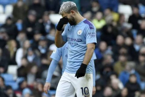 Manchester City's Sergio Aguero reacts after Crystal Palace's Cenk Tosun scoring his side's opening goal during the English Premier League soccer match between Manchester City and Crystal Palace at Etihad stadium in Manchester, England, Saturday, Jan. 18, 2020. (AP Photo/Rui Vieira)