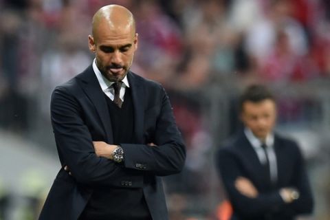 MUNICH, GERMANY - MAY 12:  Josep Guardiola head coach of Bayern Muenchen looks dejected during the UEFA Champions League semi final second leg match between FC Bayern Muenchen and FC Barcelona at Allianz Arena on May 12, 2015 in Munich, Germany.  (Photo by Matthias Hangst/Bongarts/Getty Images)