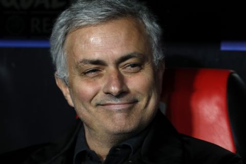 Manchester United manager Jose Mourinho smiles on the bench before the Champions League round of sixteen first leg soccer match between Sevilla FC and Manchester United at the Ramon Sanchez Pizjuan stadium in Seville, Spain, Wednesday, Feb. 21, 2018. (AP Photo/Miguel Morenatti)