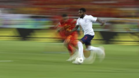 England's Danny Rose, in white shirt, runs with the ball during the group G match between England and Belgium at the 2018 soccer World Cup in the Kaliningrad Stadium in Kaliningrad, Russia, Thursday, June 28, 2018. (AP Photo/Petr David Josek)