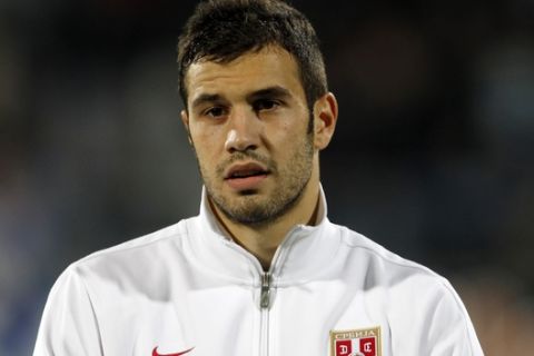 Serbia's national soccer team player Luka Milivojevic prior to playing their World Cup 2014 Group A qualifying soccer match against Macedonia, at the City Stadium in Jagodina, Serbia, Tuesday, Oct. 15, 2013. (AP Photo/Darko Vojinovic)