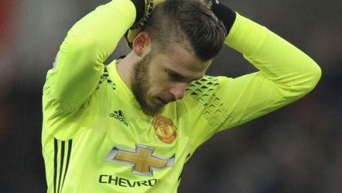 Manchester United's David De Gea reacts during the English Premier League soccer match between Stoke City and Manchester United at the Britannia Stadium, Stoke on Trent, England, Saturday, Jan. 21, 2017. (AP Photo/Rui Vieira)