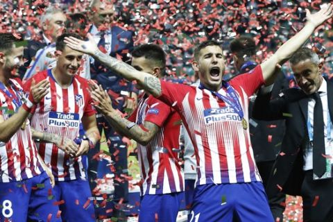 Atletico's Lucas Hernandez celebrates after the UEFA Super Cup final soccer match between Real Madrid and Atletico Madrid at the Lillekula Stadium in Tallinn, Estonia, Wednesday, Aug. 15, 2018. (AP Photo/Pavel Golovkin)