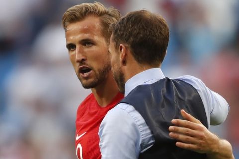 England's Harry Kane, left, and head coach Gareth Southgate celebrate their victory over Sweden during the quarterfinal match between Sweden and England at the 2018 soccer World Cup in the Samara Arena, in Samara, Russia, Saturday, July 7, 2018. (AP Photo/Frank Augstein)