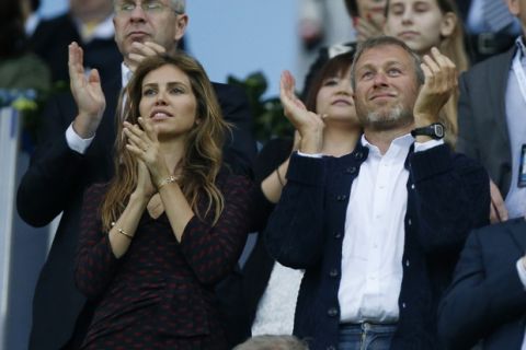 FILE - In this file photo taken on Saturday, May 19, 2012, Roman Abramovich and his partner Dasha Zhukova, left, applaud during the Champions League final soccer match between Bayern Munich and Chelsea in Munich, Germany. According to a joint statement Monday Aug. 7, 2017, 50-year old Russian tycoon Roman Abramovich and his wife Dasha Zhukova have announced their impending divorce, after ten years together. (AP Photo/Matt Dunham, file)
