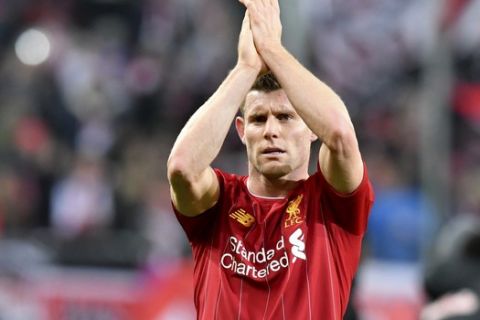 Liverpool's James Milner celebrates at the end of the group E Champions League soccer match between Salzburg and Liverpool, in Salzburg, Austria, Tuesday, Dec. 10, 2019. Liverpool won 2:0. (AP Photo/Kerstin Joensson)