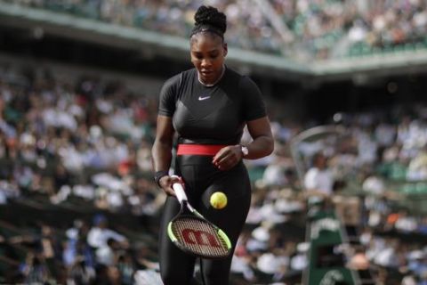 Serena Williams of the U.S. prepares to serve during her first round match against Krystina Pliskova of the Czech Republic at the French Open tennis tournament in the Roland Garros stadium in Paris, France, Tuesday, May 29, 2018. (AP Photo/Alessandra Tarantino)