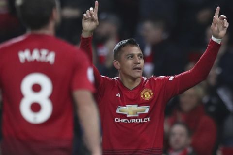 Manchester United's Alexis Sanchez celebrates after scoring his sides 3rd goal during their English Premier League soccer match between Manchester United and Newcastle United at Old Trafford in Manchester, England, Saturday, Oct. 6, 2018. (AP Photo/Jon Super)