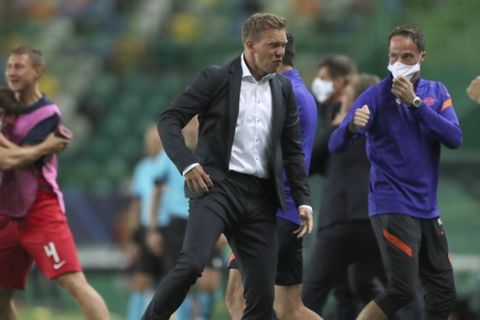 Leipzig's head coach Julian Nagelsmann celebrates his team's second goal during the Champions League quarterfinal match between RB Leipzig and Atletico Madrid at the Jose Alvalade stadium in Lisbon, Portugal, Thursday, Aug. 13, 2020. (Miguel A. Lopes/Pool Photo via AP)