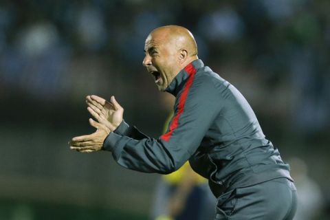 FILE - In this Nov. 17, 2015, file photo, Chilean soccer team coach Jorge Sampaoli gestures to his players during a FIFA World Cup qualifying soccer match between Uruguay and Chile in Montevideo. Sampaoli is now coach for Spain's Sevilla and the team's recent performances have raised concerns just ahead of the team's decisive Champions League match against Leicester on Tuesday March 14, 2017. (AP Photo/Victor R. Caivano, File)