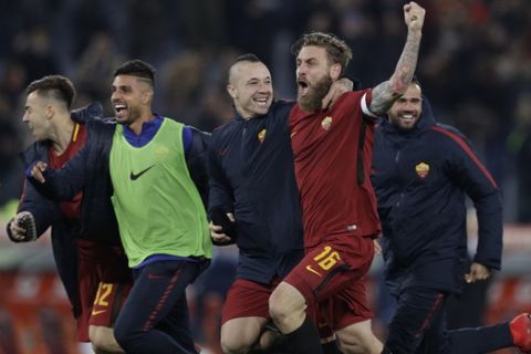 Roma players celebrate after beating cross-town rival Lazio 2 - 1 during an Italian Serie A soccer match between AS Roma and Lazio, at the Olympic stadium in Rome, Saturday, Nov. 18, 2017. (AP Photo/Andrew Medichini)