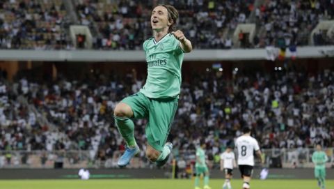 Real Madrid's Luka Modric celebrates after scoring his side's third goal during the Spanish Super Cup semifinal soccer match between Real Madrid and Valencia at King Abdullah stadium in Jiddah, Saudi Arabia, Wednesday, Jan. 8, 2020. (AP Photo/Hassan Ammar)