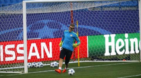 Bayer Leverkusen goalkeeper Bernd Leno kicks the ball during a training session at the Vicente Calderon stadium in Madrid, Tuesday, March 14, 2017. Leverkusen will play a Champions League round of 16 second leg soccer match against Atletico Madrid on Wednesday, March 15. (AP Photo/Francisco Seco)