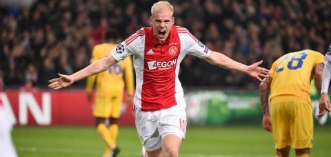 Ajax Amsterdam's Davy Klaassen celebrates after scoring during the UEFA Champions League football match, Group F, between Ajax Amsterdam and Apoel Nicosia in Amsterdam, on December 10, 2014. AFP PHOTO / EMMANUEL DUNAND        (Photo credit should read EMMANUEL DUNAND/AFP/Getty Images)