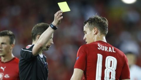 Czech Republic's Josef Sural is booked by referee William Collum, left, during the Euro 2016 Group D soccer match between the Czech Republic and Turkey at the Bollaert stadium in Lens, France, Tuesday, June 21, 2016. (AP Photo/Frank Augstein)