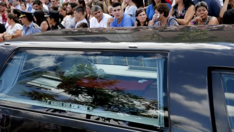 The car carrying the remains of Emiliano Sala leaves Progreso, Argentina, Saturday, Feb. 16, 2019. The Argentina-born forward died in an airplane crash in the English Channel last month when flying from Nantes in France to start his new career with English Premier League club Cardiff. (AP Photo/Natacha Pisarenko)