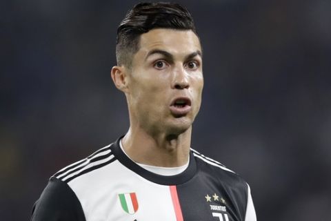 Juventus' Cristiano Ronaldo grimaces during a Serie A soccer match between Juventus and Bologna, at the Allianz stadium in Turin, Italy, Saturday, Oct.19, 2019. (AP Photo/Luca Bruno)