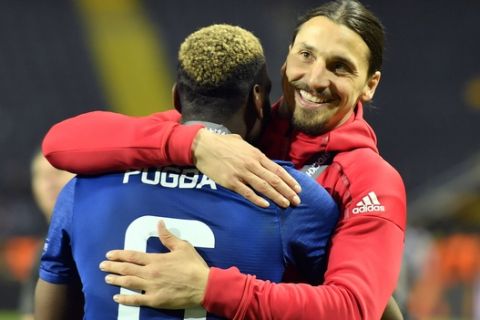 United's Zlatan Ibrahimovic, right, celebrates with teammate Paul Pogba after winning the soccer Europa League final between Ajax Amsterdam and Manchester United at the Friends Arena in Stockholm, Sweden, Wednesday, May 24, 2017. United won 2-0. (AP Photo/Martin Meissner)
