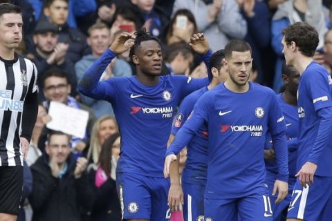 Chelsea's Michy Batshuayi, second from left, celebrates with team mates after scoring his side's second goal, during the English FA Cup fourth round soccer match between Chelsea and Newcastle United at Stamford Bridge stadium in London, Sunday, Jan. 28, 2018 . (AP Photo/Alastair Grant)