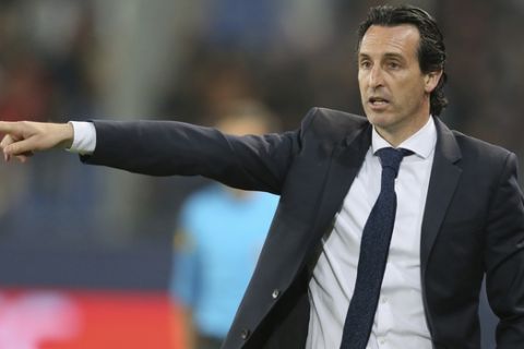 PSG head coach Unai Emery gives directions to his team during his League One soccer match between Caen and Paris Saint-Germain at the Michel d'Ornano stadium in Caen, western France, Saturday, May 19, 2018. This is his last match with the PSG team. German coach Thomas Tuchel will replace him for the next season. (AP Photo/David Vincent)