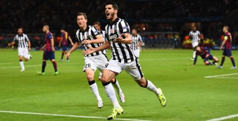 BERLIN, GERMANY - JUNE 06:  Alvaro Morata of Juventus celebrates scoring his team's first goal with Stephan Lichtsteiner during the UEFA Champions League Final between Juventus and FC Barcelona at Olympiastadion on June 6, 2015 in Berlin, Germany.  (Photo by Laurence Griffiths/Getty Images)
