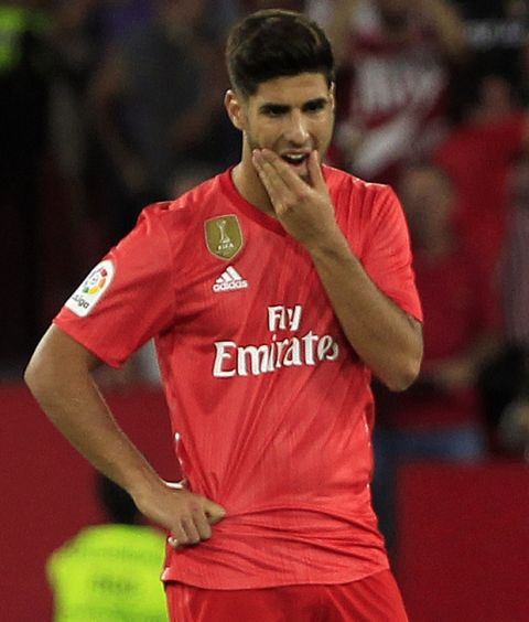 Real Madrid's Marco Asensio looks on during La Liga soccer match between Sevilla and Real Madrid at the Sanchez Pizjuan stadium, in Seville, Spain on Wednesday, Sept. 26, 2018. (AP Photo/Miguel Morenatti)