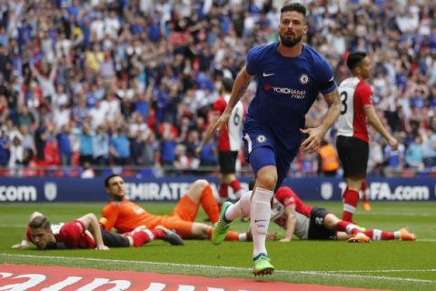 Chelsea's Olivier Giroud celebrates after scoring his side opening goal during the English FA Cup semifinal soccer match between Chelsea and Southampton at the Wembley stadium in London, Sunday, April 22, 2018. (AP Photo/Frank Augstein)