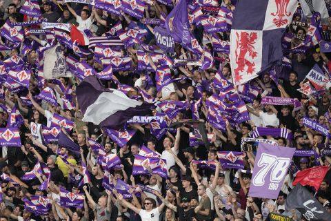Fiorentina fans wave flags before the Europa Conference League final soccer match between Fiorentina and West Ham at the Eden Arena in Prague, Wednesday, June 7, 2023. (AP Photo/Darko Vojinovic)