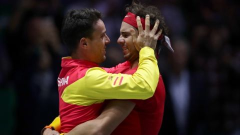 Spain's Rafael Nadal celebrates with teammate Roberto Bautista Agut, left, after defeating Canada's Denis Shapovalov in their tennis singles match to win the Davis Cup final in Madrid, Spain, Sunday, Nov. 24, 2019. (AP Photo/Manu Fernandez)