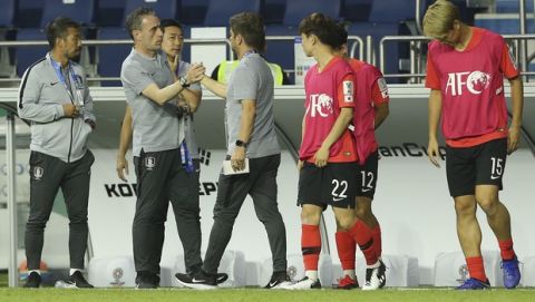 South Korea's head coach Paulo Bento, second left, is greeted after the AFC Asian Cup group C soccer match between South Korea and Philippines at Al Maktoum Stadium in Dubai, United Arab Emirates, Monday, Jan. 7, 2019. (AP Photo/Kamran Jebreili)