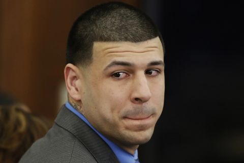 FILE - In this Friday, April 14, 2017, file photo, Former New England Patriots tight end Aaron Hernandez turns to look in the direction of the jury as he reacts to his double murder acquittal at Suffolk Superior Court in Boston. Hernandez hung himself and was pronounced dead at a Massachusetts hospital early Wednesday, April 19, 2017, according to officials. (AP Photo/Stephan Savoia, Pool, File)