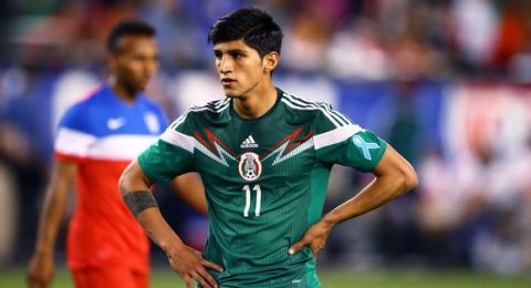 Apr 2, 2014; Glendale, AZ, USA; Mexico forward Alan Pulido (11) against USA during a friendly match at University of Phoenix Stadium. The game ended in a 2-2 tie. Mandatory Credit: Mark J. Rebilas-USA TODAY Sports