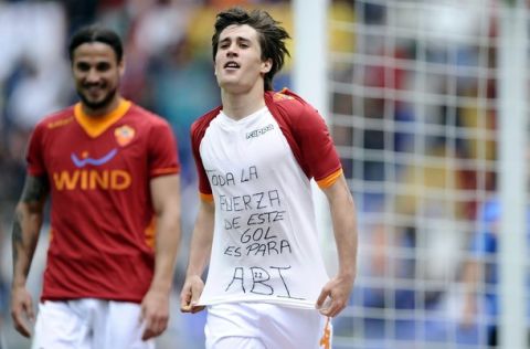 AS Roma's Spanish forward Bojan Krkic Perez shows his t-shirt reading "All the power of this goal is for Abi (Eric Abidal)" as he celebrates scoring against Novara during the Serie A football match in Rome's Olympic Stadium on April 1, 2012. Abidal, 32, had a tumour removed from his liver in March 2011. The announcement that he now has to have a transplant has seen an outpouring of support from the world of football.     AFP PHOTO / Filippo MONTEFORTE (Photo credit should read FILIPPO MONTEFORTE/AFP/Getty Images)
