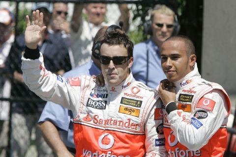 McLaren Mercedes driver Fernando Alonso of Spain, left, and teammate Lewis Hamilton of Britain react after qualifying for the Canadian Grand Prix, Saturday, June 9, 2007 in Montreal. (AP Photo/Darron Cummings)