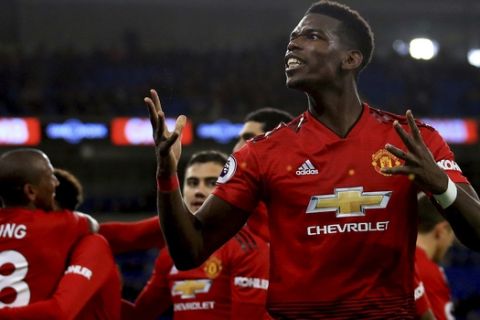 Manchester United midfielder Paul Pogba celebrates the fifth goal against Cardiff City during the English Premier League match between Cardiff City and Manchester United at the Cardiff City Stadium in Cardiff, Wales, Saturday Dec. 22, 2018. (AP Photo/ Jon Super)