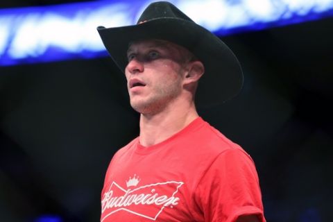 In this Jan. 18, 2015 photo Donald 'Cowboy' Cerrone is seen after a fight at UFC Fight Night in Boston. Cerrone is set for the fight of his MMA career when he takes on Conor McGregor in the main event of UFC 246 in January in Las Vegas. Cerrone is UFCs record-holder for most victories and finishes. But hes never won a UFC championship and never fought in a fight with this much hype. (AP Photo/Gregory Payan)