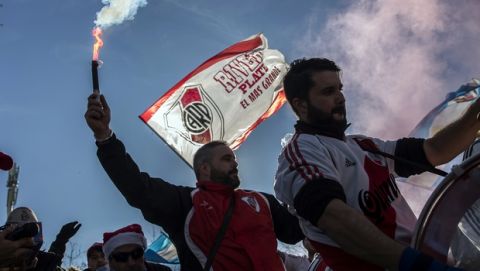 River Plate supporters cheer ahead of the Copa Libertadores Final between River Plate and Boca Juniors in Madrid, Sunday, Dec. 9, 2018. Tens of thousands of Boca and River fans are in the city for the "superclasico" at Santiago Bernabeu Stadium on Sunday. (AP Photo/Olmo Calvo)
