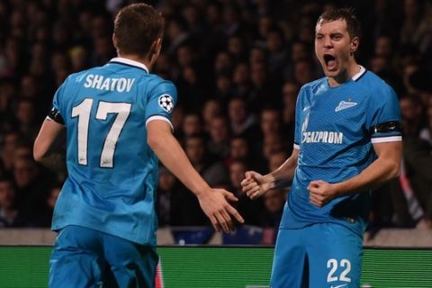 Zenit's Russian forward Artem Dzyuba (R) celebrates with teammate after scoring a goal during an UEFA Champions League Group H football match between Lyon and Zenit Saint-Petersburg at the Stade de Gerland stadium in Lyon, southeastern France on November 4, 2015. AFP PHOTO / PHILIPPE DESMAZES        (Photo credit should read PHILIPPE DESMAZES/AFP/Getty Images)