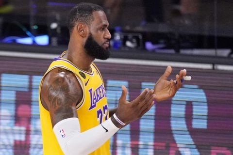 Los Angeles Lakers' LeBron James (23) reacts to a call during the first half of an NBA conference final playoff basketball game against the Denver Nuggets Thursday, Sept. 24, 2020, in Lake Buena Vista, Fla. (AP Photo/Mark J. Terrill)
